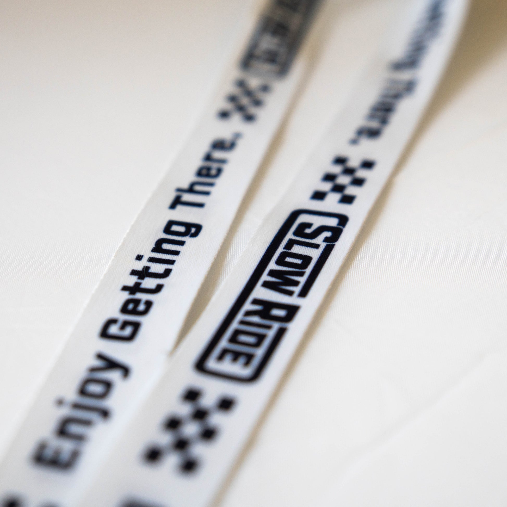 Enjoy Getting There. Lanyard (White) - Slow Ride