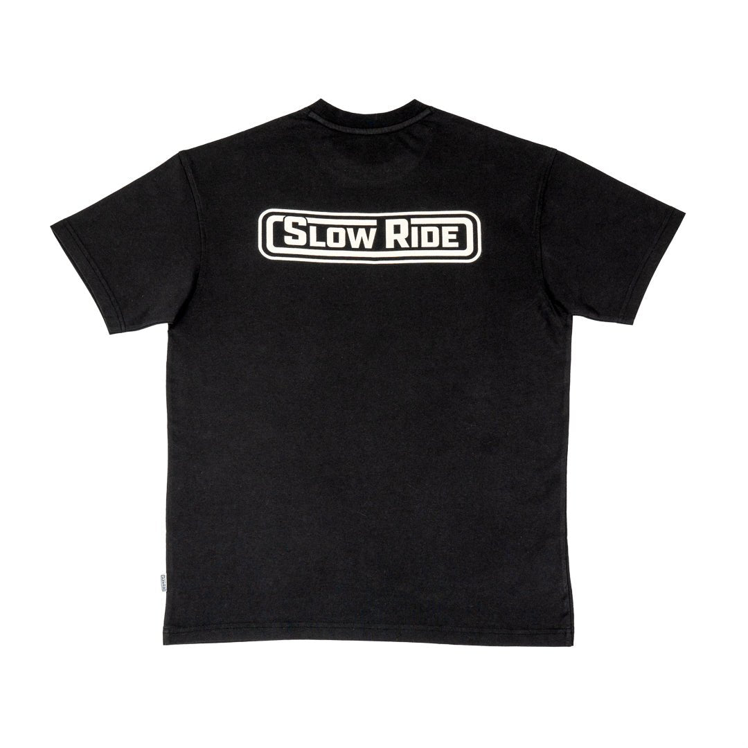 Radio Heavyweight Tee (Black), back of shirt- Classic Slow Ride t-shirt available in black and gray, featuring the iconic 'Slow Ride' logo on the back. Ideal for fans of Off-Roading and Off-Road Racing, this slow ride shirt celebrates the vintage Volkswagen culture, including the Volkswagen bus, Volkswagen bug, and Baja bug. Perfect for those who embrace the Garage and Racing lifestyle and live by mottos like 'Enjoy Getting There,' 'Wheelin and Spilling,' and 'Restore and Destroy.' A must-have for blue-col