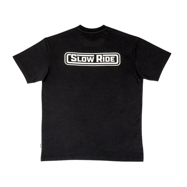  Radio Heavyweight Tee (Black), back of shirt- Classic Slow Ride t-shirt available in black and gray, featuring the iconic 'Slow Ride' logo on the back. Ideal for fans of Off-Roading and Off-Road Racing, this slow ride shirt celebrates the vintage Volkswagen culture, including the Volkswagen bus, Volkswagen bug, and Baja bug. Perfect for those who embrace the Garage and Racing lifestyle and live by mottos like 'Enjoy Getting There,' 'Wheelin and Spilling,' and 'Restore and Destroy.' A must-have for blue-col