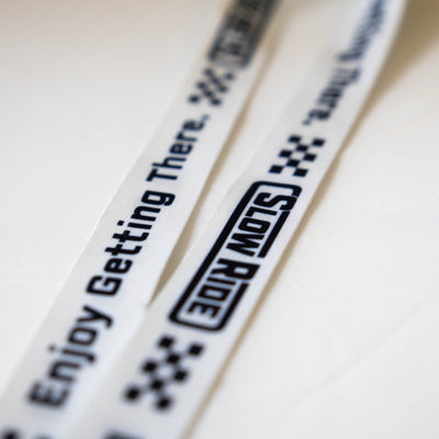Enjoy Getting There. Lanyard (White) - Slow Ride