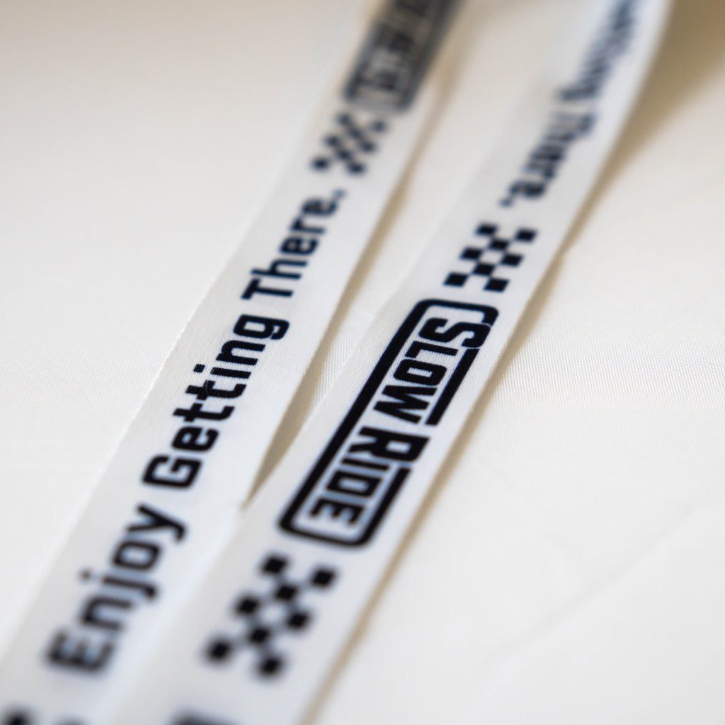 Enjoy Getting There. Lanyard (White) - Slow Ride