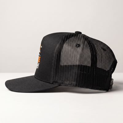 Back of Landscape Trucker Black Hat, Black mesh back panel with ventilation holes and structured crown seam - Slowride Supply