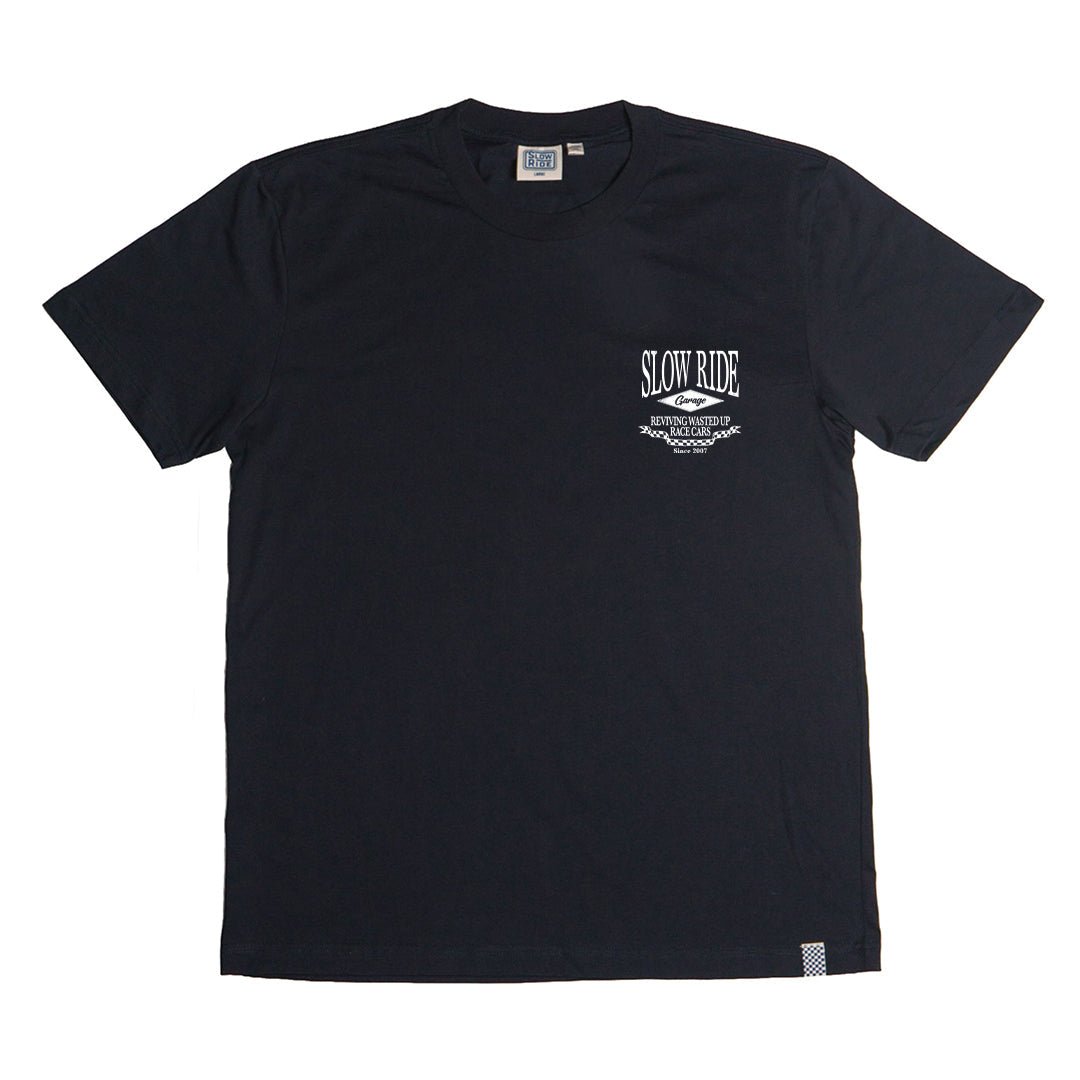 Close-up of Shop White Tee showing Black with white "Slow Ride" text and decorative wing motif on chest, small checkered