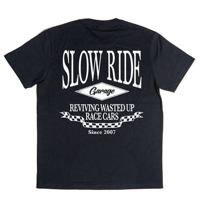 Close-up of Shop White Tee showing Black tee with white back graphic reading "Slow Ride Garage" and "Reviving Wasted Up Race